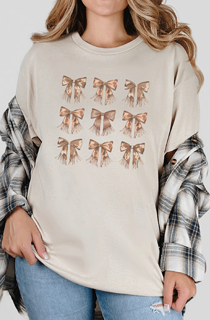 T-Shirt Sand / S Cow Print Coquette Bow Pattern Tee